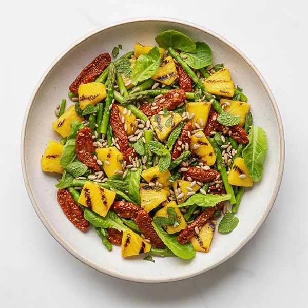 Summer Special Salad – Asparagus Tips, Sundried Tomato, Sunflower seed & Grilled Pineapple with Mint Vinaigrette
